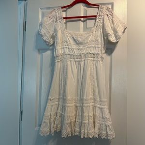 White boho cotton and lace dress with smocked bodice from Victoria’s Secret.